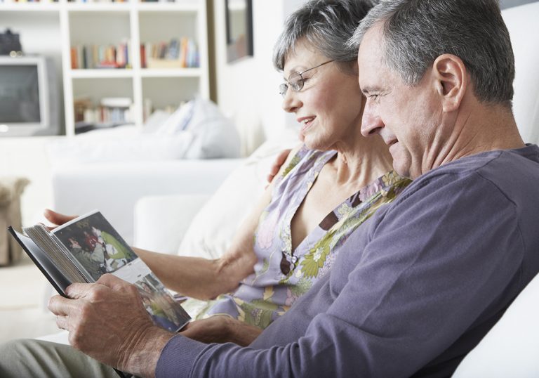 A couple looking at pictures